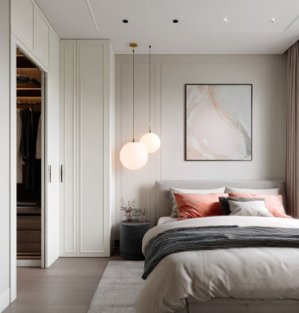 This image showcases a modern bedroom interior featuring a comfortable bed, soft textiles, and elegant lighting fixtures. The composition emphasizes clean lines, neutral colors, and a minimalist style. Suitable for various applications, it could be used in advertising, architectural presentations, or lifestyle publications. The ambiance suggests a sense of calm and relaxation.の素材
