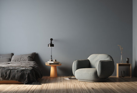 This interior scene showcases a modern living space with gray walls and wooden flooring. It features a bed, an armchair, and small side tables. The composition is balanced and includes ambient lighting, suggesting a comfortable, indoor environment suitable for various commercial applications.の素材