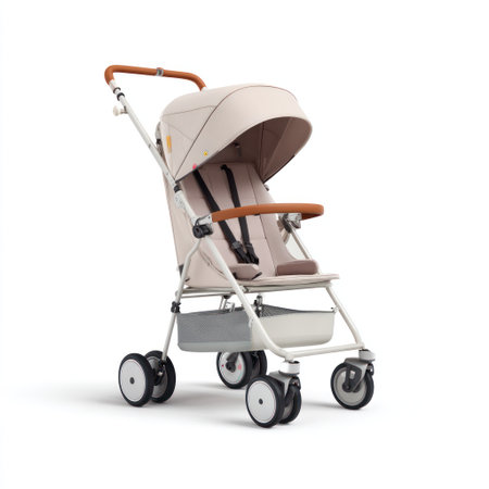 A contemporary beige stroller is presented against a stark white backdrop. The design incorporates a curved canopy, a seat with straps, and a storage basket. It is captured with a high-key lighting style. This image is suitable for various uses including advertising and product catalogs.の素材