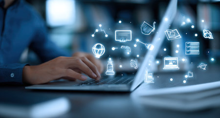 A person is shown working on a laptop. Digital icons representing various functions and connections are overlaid on the image. The composition features soft lighting and a focus on technology. It could be used in articles or advertisements related to technology, business, or the internet.の素材