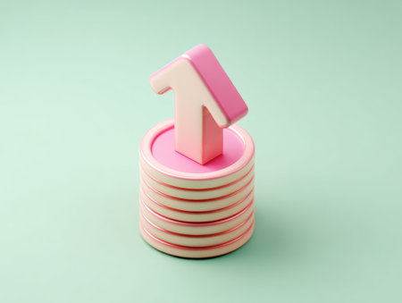 An upward-pointing arrow sits atop a stack of pink coins against a soft teal backdrop. The image utilizes a minimalist style, emphasizing the interplay of colors and geometric shapes. It features clean lines, soft lighting, and a clear composition. Suitable for various applications related to finance, growth, or progress.の素材