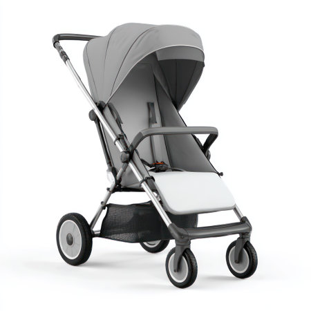 A contemporary stroller featuring a gray canopy and frame, presented against a white backdrop. The design incorporates curved lines and a minimalist aesthetic. This image is suitable for commercial applications related to childcare, parenting, and product promotion, showcasing baby transport options.の素材