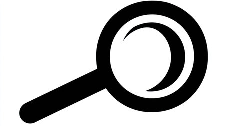 A minimalist black and white icon depicts a magnifying glass. The graphic features clean lines, highlighting the circular lens and the handle. The design suggests investigation and discovery, suitable for illustrating ideas of search, exploration, and finding information, with potential uses in various commercial applications.の素材