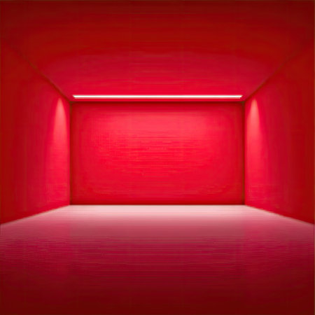 An empty red room is illuminated by overhead and corner lighting creating shadows. The scene focuses on a plain rectangular space, with smooth walls and a textured floor. This architectural rendering could be used for various design, artistic, or commercial purposes. The monochromatic color palette emphasizes the form and the light.の素材
