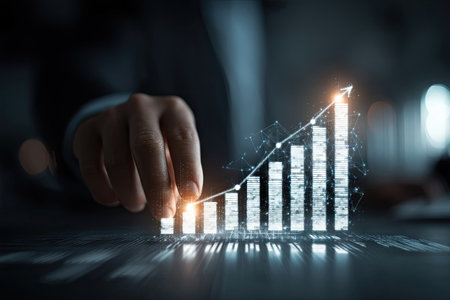 A hand touches a glowing digital graph displaying financial growth, with an upward trend indicated by an arrow. The image showcases white bars and a line against a dark background, suggesting a business context. The composition uses light and shadows to highlight the chart. Suitable for commercial and editorial applications related to finance and investment.の素材