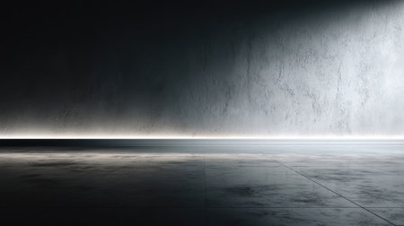 A stark minimalist composition presents a textured concrete wall and floor bathed in dramatic lighting. The interplay of light and shadow emphasizes the rough surface and creates a sense of depth and contrast. This image is suitable for various commercial purposes, including design backgrounds and conceptual illustrations.の素材