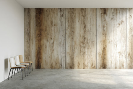 An interior space displays a row of chairs set against a textured wooden wall. The composition uses neutral colors and lighting to create a minimalist ambiance. The image could be suitable for architectural, design, or conceptual projects. The scene has a sense of modern simplicity.の素材