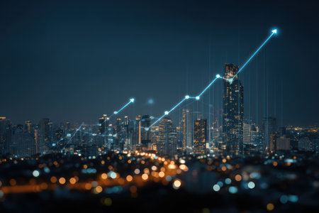 A nighttime cityscape is illuminated by artificial lights, with a visual representation of a rising line graph overlayed. The composition highlights buildings and structures, creating a sense of urban development and technological advancement. This imagery could be employed in various projects relating to business, finance, or innovative concepts.の素材