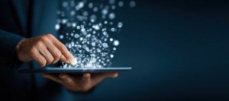 A person is shown interacting with a tablet computer, with digital elements emanating from it. The image features a dark color palette with a modern aesthetic, suggesting a digital or technological context. Suitable for commercial or editorial applications related to technology or information processing.の素材