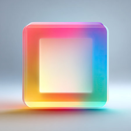 An abstract rendering presents a colorful cube with rounded corners and a soft, glowing appearance. The image showcases a gradient of colors including yellow, orange, pink, and blue, suggesting a modern and digital aesthetic. The composition features a neutral background suitable for diverse commercial applications.の素材
