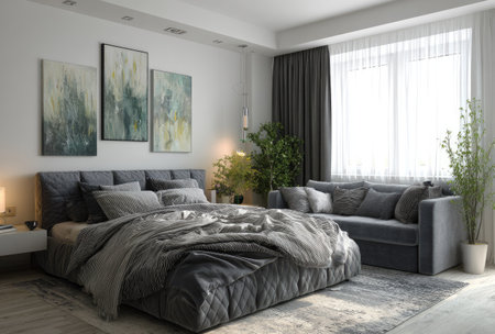 A well-lit bedroom interior showcases a large bed and a comfortable sofa. The scene features a neutral color palette with shades of gray and white, complemented by artwork on the wall. Natural light streams in through a large window, enhancing the ambiance. Suitable for interior design, real estate, or lifestyle editorial use.の素材