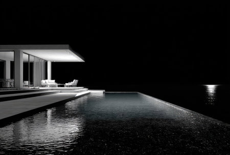 An architectural image shows a modern house featuring an infinity pool. The scene is illuminated by exterior lighting, creating reflections on the water surface. The monochromatic style emphasizes the structure's geometric forms and the interplay of light and shadow, suggesting a luxurious setting. Suitable for commercial and editorial purposes.の素材