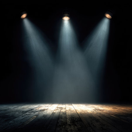 This image features three bright spotlights illuminating a wooden floor. The composition emphasizes light and shadow, with beams of light piercing the darkness. The scene evokes a sense of anticipation and drama. Suitable for various creative projects, including presentations and advertising campaigns.の素材