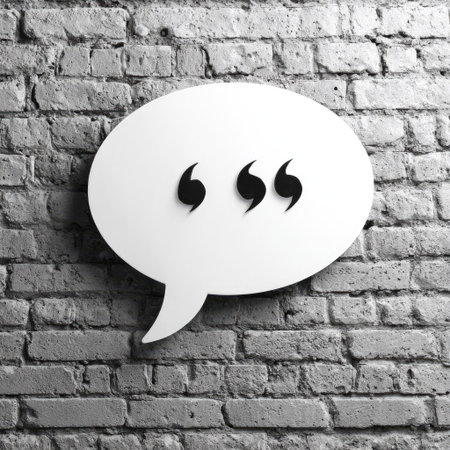 A white speech bubble featuring quotation marks is positioned against a textured brick wall. The composition displays a contrasting palette of white and gray, enhancing the visual focus. Suitable for diverse applications, it can be employed for various communication-related design endeavors, including editorial and marketing visuals.の素材