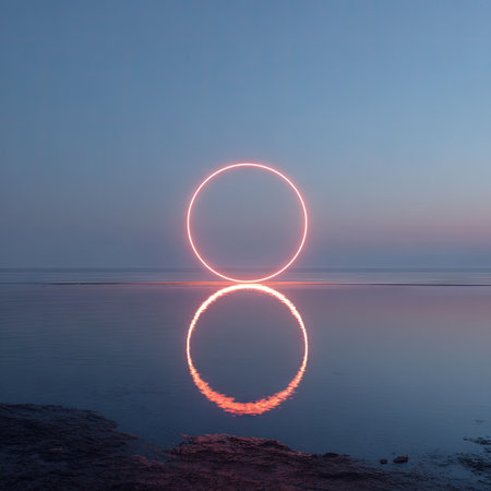 An illuminated circle reflects on the still water, creating a mirrored image against a dusky sky. The composition emphasizes symmetry and balance. The scene employs a gradient of blues and oranges, suggesting a twilight or dawn setting. Ideal for design projects and conceptual visuals, this image evokes a sense of peace.の素材