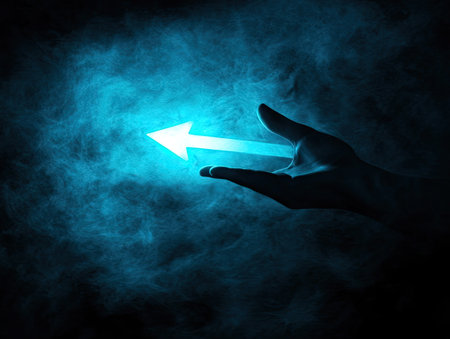A hand cradles a radiant, white arrow against a deep, smoky blue backdrop. The image features a strong contrast of light and shadow, with the arrow emitting a bright glow. It can be used for various commercial projects related to direction, guidance, or decision-making, offering a visual for concepts.の素材
