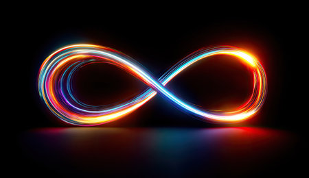 An illuminated infinity symbol is depicted, created with streaks of colorful light. The image showcases a smooth, blurred texture with dynamic lines and gradients of orange, blue, and red hues. The composition is set against a black background, suggesting a digital or conceptual environment suitable for various commercial uses.の素材