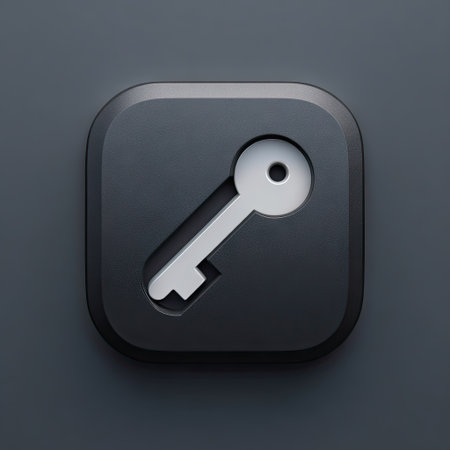 A close-up image showcases a white key icon on a dark gray, rounded square background. The key appears to be a 3D rendering with subtle gradients. The overall composition is centered, with soft lighting enhancing the textures. This image may be suitable for illustrating security, access, or privacy concepts in various commercial applications.の素材