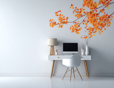 A minimalist workspace features a desk with a computer and decorative elements. The room is brightly lit with a white wall backdrop. An orange floral branch is positioned overhead. This arrangement could be suited for interior design, lifestyle imagery, or other creative applications.の素材