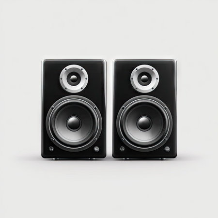 Two modern black audio speakers are centered on a white backdrop. The speakers have circular mid-range and woofer designs. The image is rendered with even, shadowless lighting, and the background is a smooth gradient. It is well-suited for advertising audio equipment, music, or technology-related publications.の素材