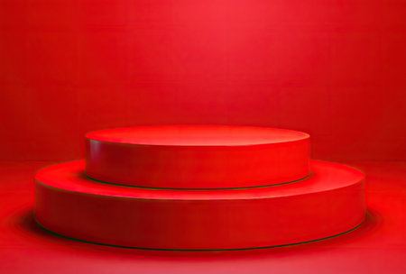 A striking two-tiered podium is featured in this image, rendered in a solid, vibrant red hue. The composition highlights a clean, minimalist design with smooth surfaces and gentle lighting. This visually dynamic image could be useful for commercial projects, presentations, and product displays, offering a bold background and copy space.の素材