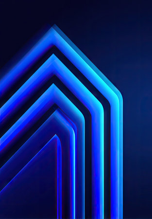 Abstract composition featuring several layered neon blue geometric shapes against a dark blue background. The image highlights a series of sharp lines and curves creating an impression of depth and perspective. This design, with its futuristic look, could be used for various projects.の素材