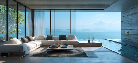 An interior showcases a modern living room featuring a comfortable sofa and coffee table. The open design offers a panoramic view of the ocean, seen through large windows. Neutral color tones, natural light, and a sleek style create a serene atmosphere. Suitable for editorial or commercial projects.の素材