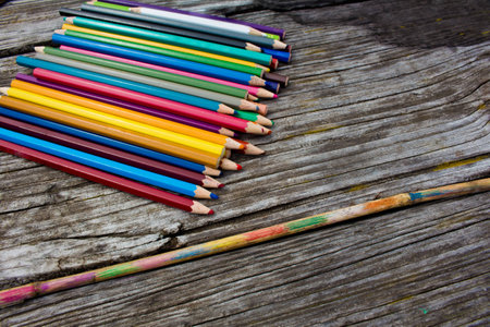 Drawing in the nature with colored pencils on wooden table. Paintings on a bamboo stick.の写真素材