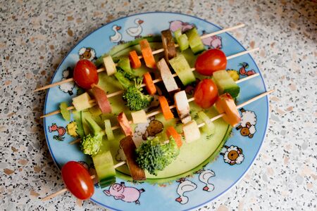 Healthy food. Make vegetables and fruits tasty for children with vegetable skewers.の写真素材