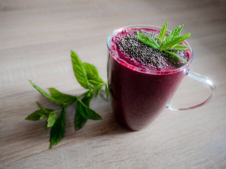 Red berry smoothie with mint leaves. Red smoothie.の写真素材