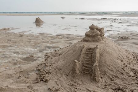 Temple of sand on the beach. Like a sandcastle. Bentota Beach in Sri Lanka.の写真素材