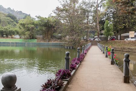 Bridge and river in Kandy, Sri Lanka with flowers and nature.の写真素材