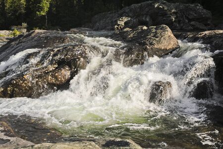 Fast flowing river water of the waterfall Rjukandefossen in Hemsedal, Buskerud, Norway.の写真素材
