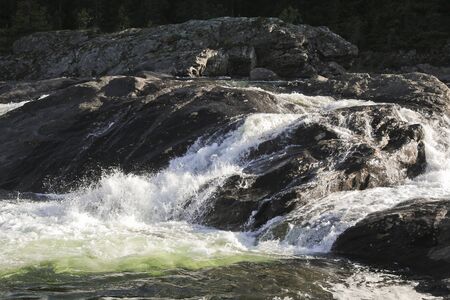 Fast flowing river water of the waterfall Rjukandefossen in Hemsedal, Buskerud, Norway.の写真素材