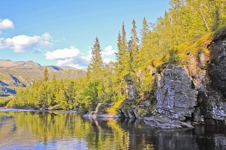 River of the beautiful waterfall Rjukandefossen with mountain and village views of Hemsedal, Buskerud, Norway.の写真素材