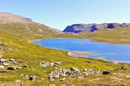 Beautiful Vavatn lake and mountains in the summertime in Hemsedal, Buskeud, Norway.の写真素材
