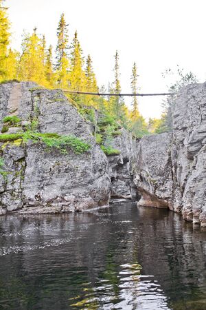 Beautiful suspension bridge over the Rjukandefossen waterfall in Hemsedal, Norway.の写真素材