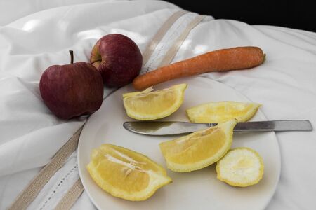 Lemons, apples and carrots, the healthy raw food breakfast.の写真素材