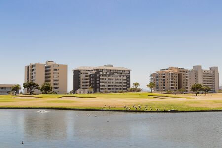 Hotel Facilities Panorama behind the lake or river in Green Point Park in Cape Town, South Africa, in Africa.の写真素材