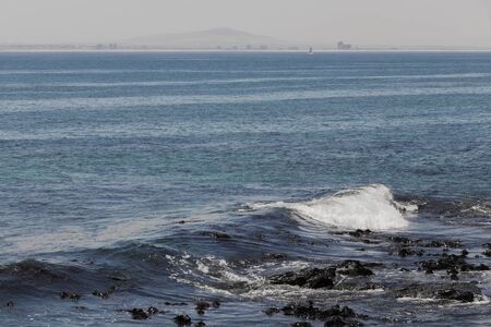 Deep blue water with waves at the Sea Point, beach promenade in Cape Town South Africa.の写真素材