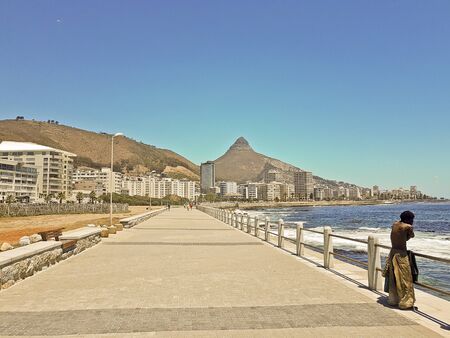 Poor and rich life at the Sea Point, beach promenade in Cape Town South Africa.の写真素材