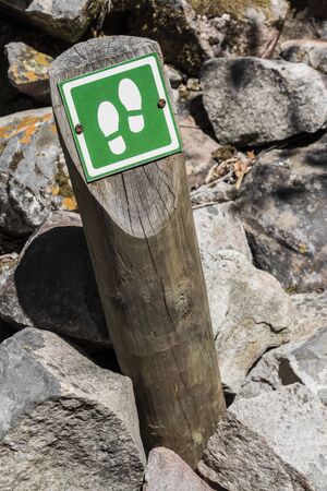 Hiking route in Cape Town to Table Mountain. Signpost with footprints.の写真素材