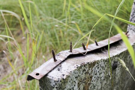I wouldn't sit on that bench. Big risk of injury! nails and screws!の写真素材