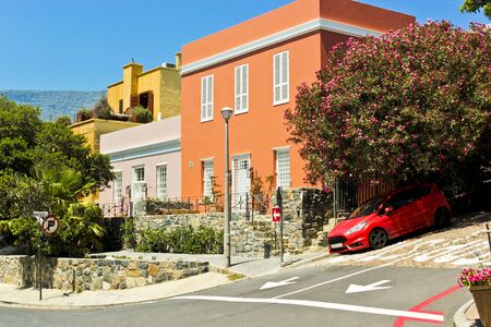 Red slanted sports car in the Bo-Kaap district, Cape Town, South Africa.の写真素材
