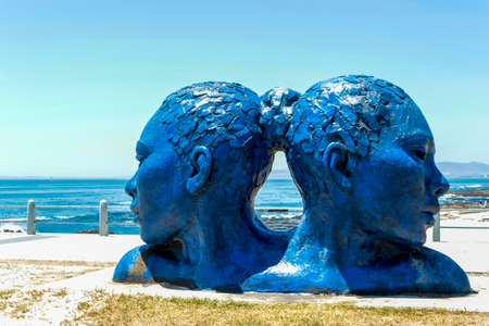 Blue heads statue in Cape Town. Art of south Africa. Sea point promenade