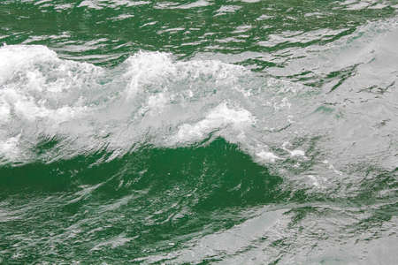 Green turquoise water with waves. Texture from above in Sognefjord Norway.