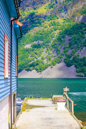 Colorful wooden houses and architecture by the pier in Undredal village Aurlandsfjord Aurland Vestland Sognefjord in Norway.の写真素材