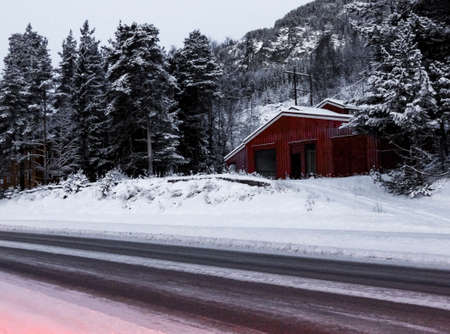 Driving at night through mountains, villages and forests in Norway.