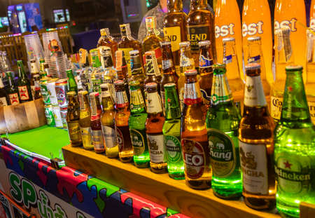 Chang, Singha and Leo beer Thai night market street food in Huai Khwang, Bangkok, Thailand.のeditorial素材