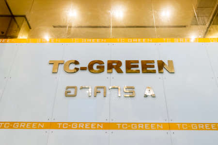 Illuminated logo of the condominium TC GREEN in Bangkok, Thailand.のeditorial素材